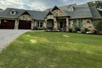 Example of a country exterior home design in Dallas