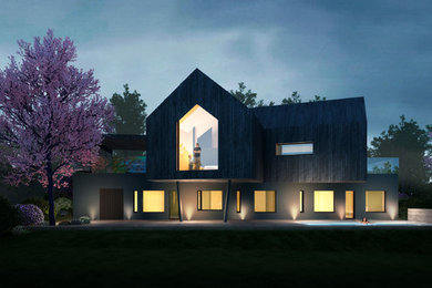 На фото: трехэтажный, деревянный, черный частный загородный дом в современном стиле с двускатной крышей и крышей из смешанных материалов с