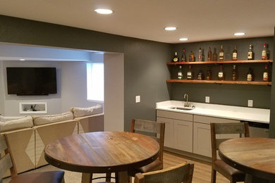 Home bar - transitional home bar idea in Denver
