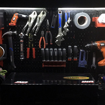 Black Metal Pegboard Offers a Sleek Garage Tool Organization Look