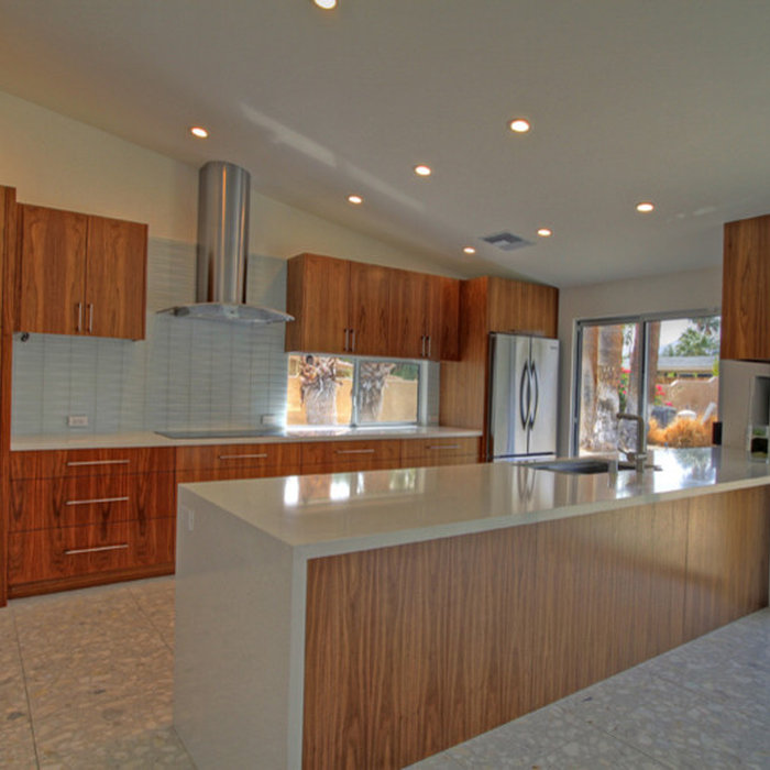 Modern kitchen with custom made cabinets, white Cesar Stone counter tops with waterfall edge.  Led recessed can lights.  Clean and modern style.