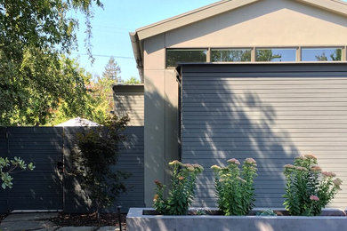 Inspiration for a large contemporary multicolored one-story mixed siding exterior home remodel in San Francisco with a tile roof