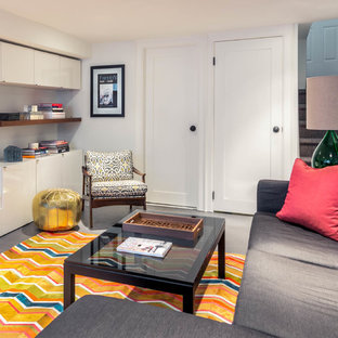 Inspiration for a small eclectic look-out basement in Toronto with white walls, no fireplace and grey floors.