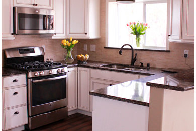 Example of a small transitional u-shaped dark wood floor enclosed kitchen design in Other with an undermount sink, beaded inset cabinets, white cabinets, quartzite countertops, beige backsplash and stainless steel appliances