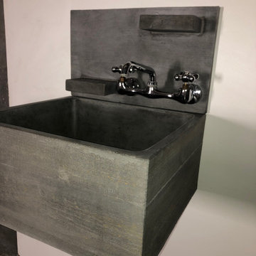 Wood grain concrete utility sink with backsplash