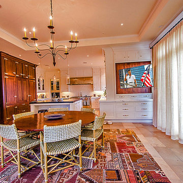Kitchen with TV on motorized articulating arm