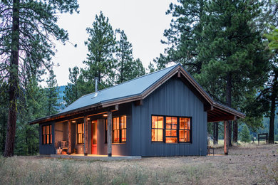 Rustic gray one-story exterior home idea in Other with a metal roof