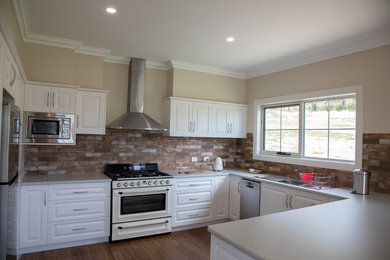 Transitional kitchen in Other.