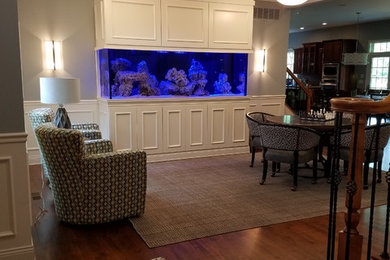 Family room - transitional family room idea in Cincinnati with a wall-mounted tv