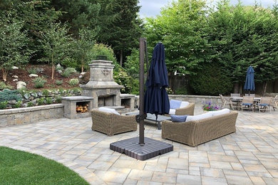 Interlocking Paver Patio with Fireplace and Sitting Wall by Aguiar Pavers