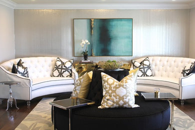 Inspiration for a mid-sized contemporary formal and open concept medium tone wood floor and brown floor living room remodel in Los Angeles with beige walls, no fireplace and no tv