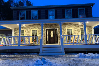 Inspiration for a huge modern front porch remodel in Burlington