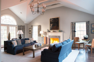 Large elegant dark wood floor living room photo in New York with white walls, a standard fireplace, a stone fireplace and no tv