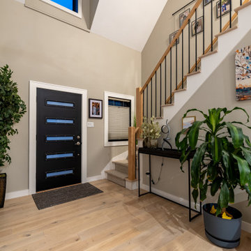 Open Staircase with Modern Railing and Light-Filled Entry – Cape Ann MA