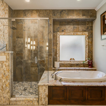 Warm Master Bathroom With Hints of the Outdoors