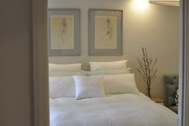 This is an example of a contemporary bedroom in Sydney.