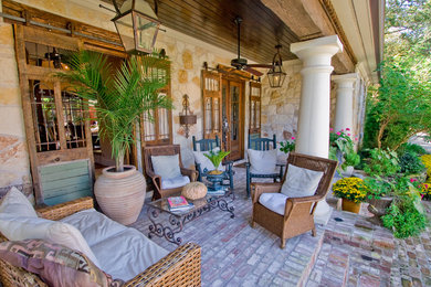 This is an example of a traditional verandah in Little Rock with brick pavers.