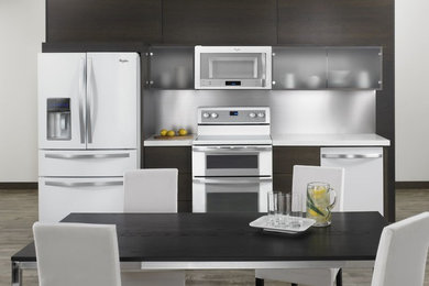 Inspiration for a modern kitchen remodel in Cleveland with white appliances