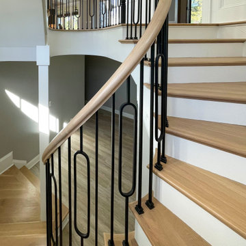 Project #95 | Freestanding Elliptical Staircase with Geometric Iron Balusters