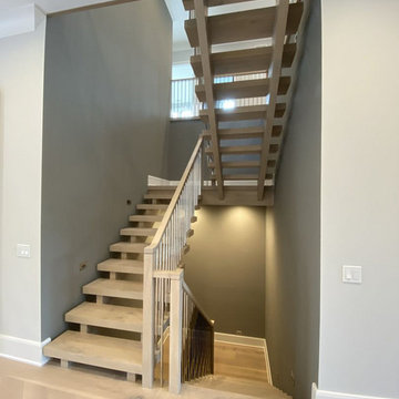 White Oak Stairs with Polished Stainless Steel Balusters