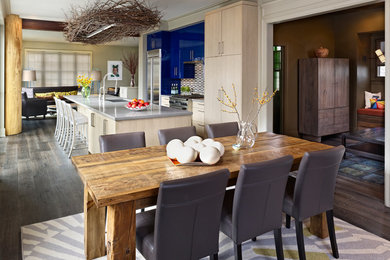 Inspiration for a contemporary galley open concept kitchen remodel in Denver with an undermount sink, flat-panel cabinets, blue cabinets, multicolored backsplash and stainless steel appliances