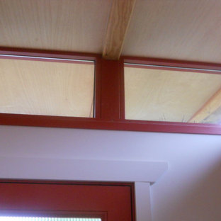 Inspiration for a large modern home studio in Seattle with white walls.