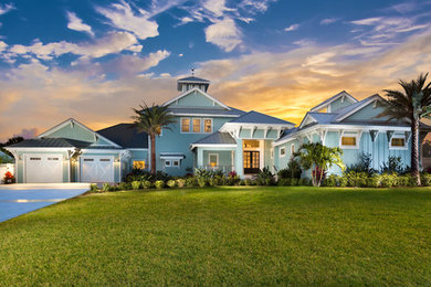 Example of a beach style home design design in Orlando