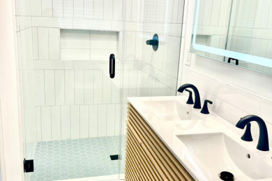 Example of a mid-century modern bathroom design in Charlotte