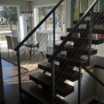 Open riser stairs with stainless steel cable wire railing