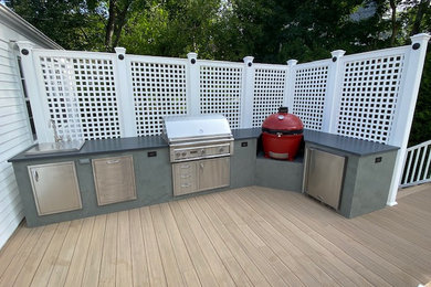 Inspiration for a mid-sized backyard outdoor kitchen deck remodel in New York