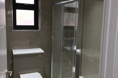 Photo of a contemporary family bathroom in London with porcelain flooring and a built in vanity unit.
