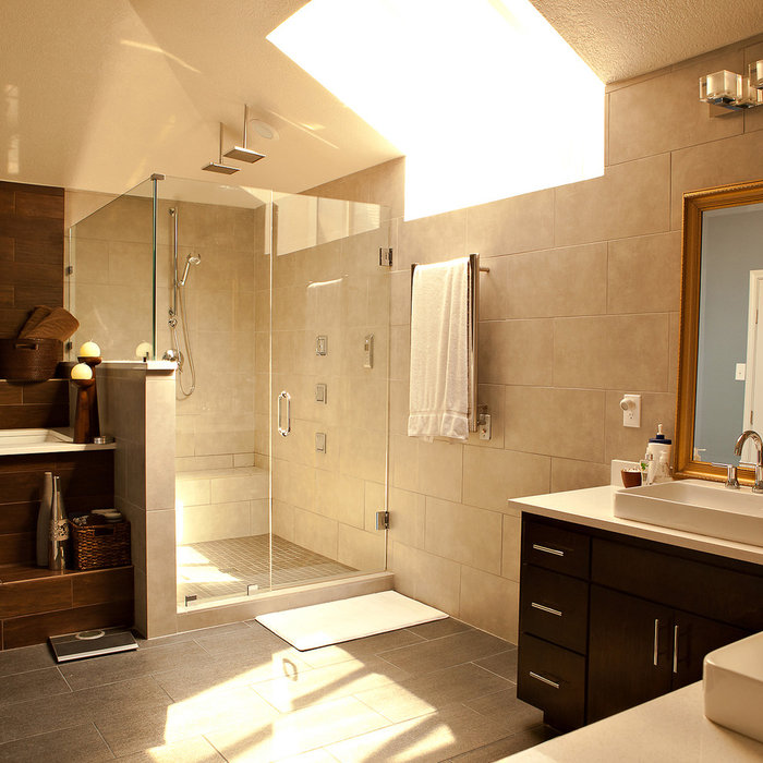 North Dallas remodeled Contemporary Master Spa Bathroom with quartz countertops, cherry wood cabinets, custom lighting, squared raised basins, oversized tiles used for flooring and accent walls, custo