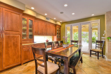 Mid-sized traditional open plan dining in San Diego with yellow walls, ceramic floors and no fireplace.