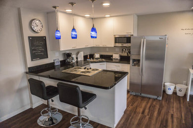 Example of a small minimalist vinyl floor kitchen design in San Diego