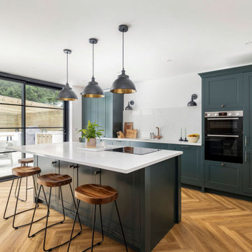 Industrial inspired, smokey green kitchen-diner