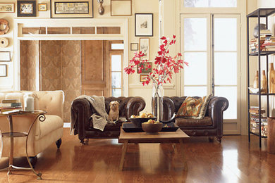 Inspiration for a mid-sized transitional formal and enclosed medium tone wood floor and brown floor living room remodel in Providence with no tv, white walls and no fireplace