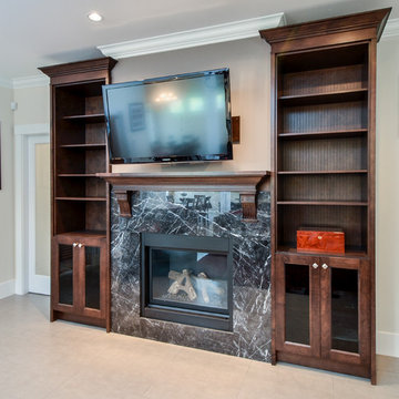 Contemporary living room with shaker style cabinets and fireplace Vancouver