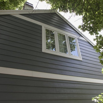 Shiny new Andersen Windows, Evening Blue James Hardie siding & stone accents