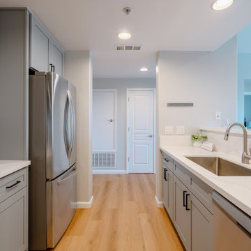 Modern Gray Shaker Kitchen Cabinets with Stainless Steel Appliances The Cabinati