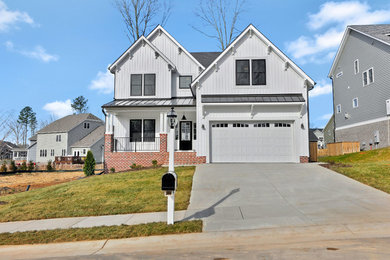 Mid-sized farmhouse white two-story vinyl exterior home photo in Richmond with a shingle roof