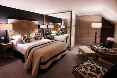 Example of a bedroom design in Kolkata with blue walls