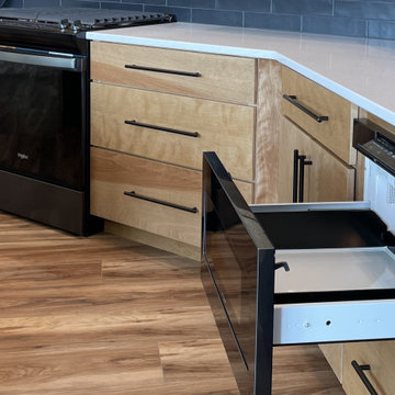 Angled Kitchen Design with Slab Style Cabinets in Pecan Stain