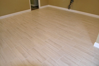Example of a mid-sized classic porcelain tile and beige floor dining room design in Tampa