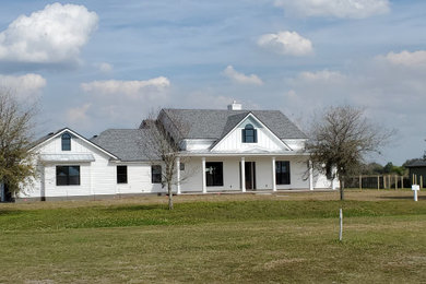 Example of a cottage chic exterior home design in Other