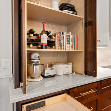 Appliance garage cabinet details with charging drawer and marble countertop