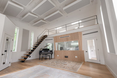 Example of a minimalist home studio design in Nashville with white walls