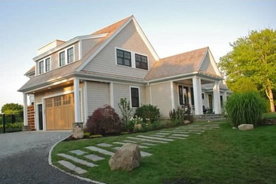 Example of a beach style home design design in Boston