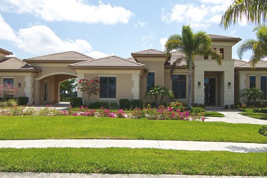 Example of a huge transitional home design design in Miami