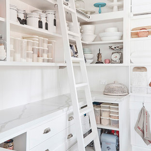 Large farmhouse kitchen pantry designs - Inspiration for a large cottage u-shaped medium tone wood floor and brown floor kitchen pantry remodel in Sydney with white cabinets, marble countertops, white backsplash, subway tile backsplash and open cabinets