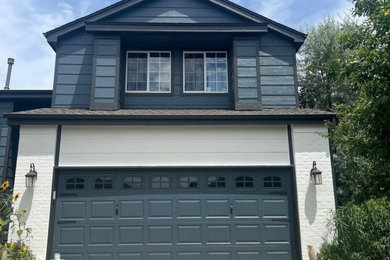 Example of a mid-sized blue two-story exterior home design in Denver